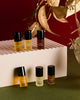 Discovery Collection minis on a pink plinth with gold leaves